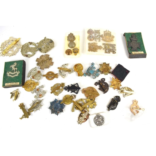 39 - A group of regimental cap and collar badges and buttons, including the 2nd Volunteer Highland Light ... 