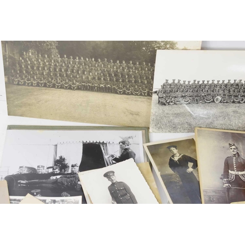 44 - A group of regimental cap, collar and uniform badges, including the Huntingdonshire, Army Pay Corps,... 