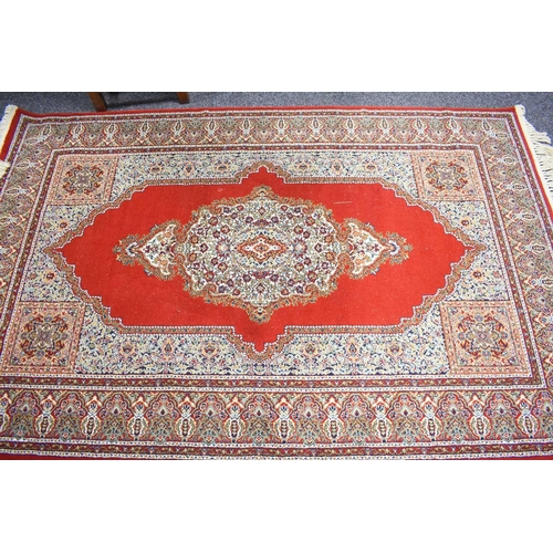 455 - A Turkish Wool Touch Acrylic machine woven rug, with central medallion on red ground and deep border... 