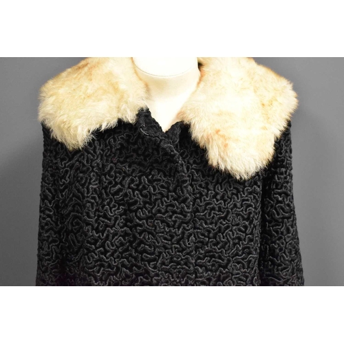 481 - A vintage Astragan coat with fur collar.