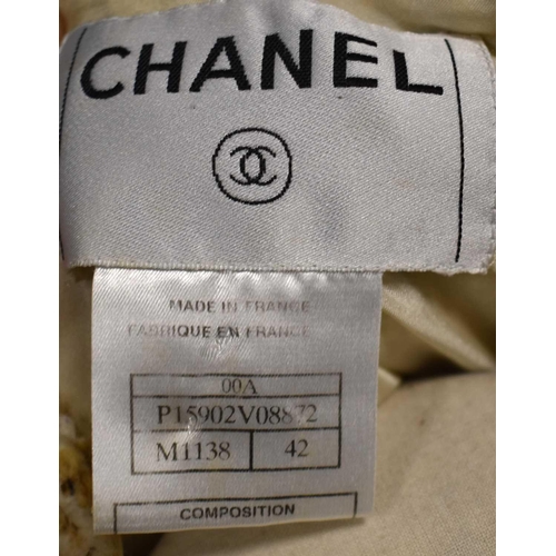 488 - A Chanel wool jacket, of classic form the cream ground with gold chevrons, and having cream silk lin... 