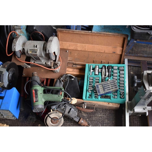 495 - A large group of tools to include a petrol lawnmower, air compressor, bench grinder, trolley jack, s... 