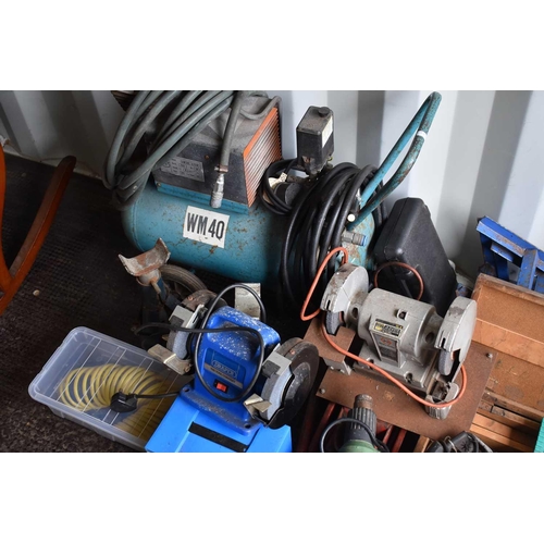 495 - A large group of tools to include a petrol lawnmower, air compressor, bench grinder, trolley jack, s... 