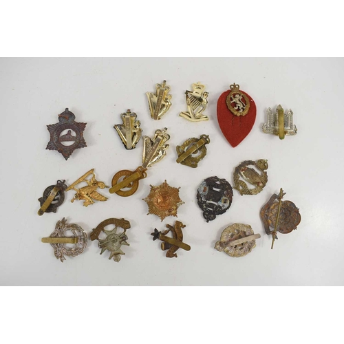 50 - A group of military cap badges to include Shropshire Yeomanry, Notts & Derby, Royal Guernsey, Royal ... 