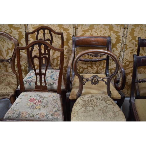 512 - A group of Victorian and later dining chairs, to include an examples with c scroll arms, all are uph... 