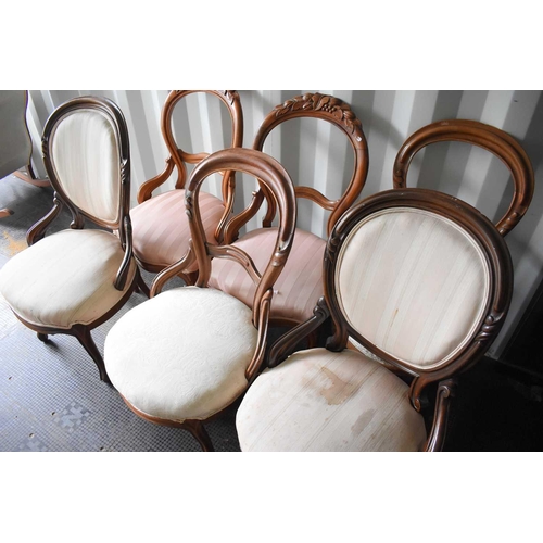 514 - A group of Victorian balloon back chairs, some with carved backs, in cream and pink fabrics.