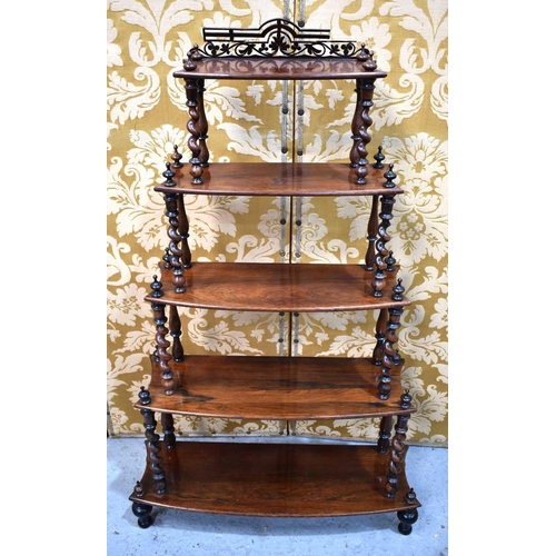 533 - A 19th century rosewood whatnot composed of five graduated shelves united by barley twist spindles, ... 