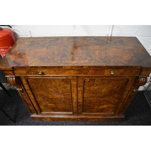 536 - A Victorian burr walnut chiffonier sideboard having two drawers above two cupboard doors, 93cms tall... 