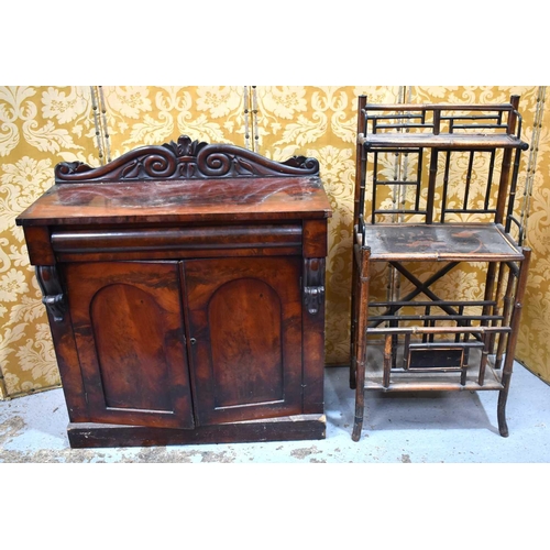 537 - A Victorian mahogany sideboard having a carved shaped back together with a Victorian bamboo canterbu... 