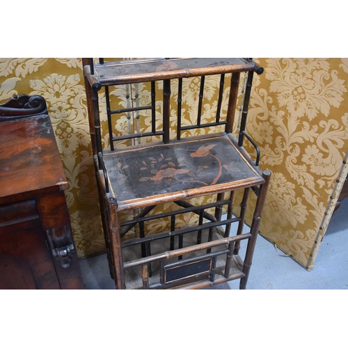 537 - A Victorian mahogany sideboard having a carved shaped back together with a Victorian bamboo canterbu... 