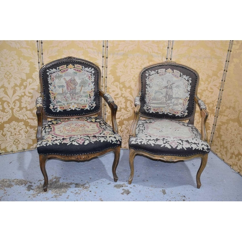 543 - A pair of French Louis XV style armchairs, with needlepoint upholstery, the seats depicting birds an... 