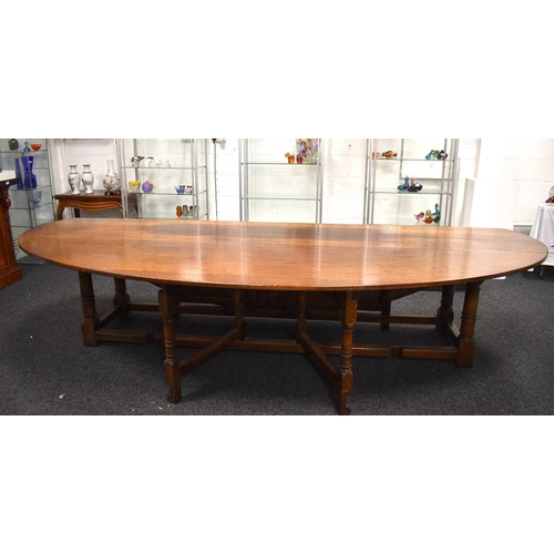 549 - A large oak drop leaf table in the refectory style, 336cm by 200cm.