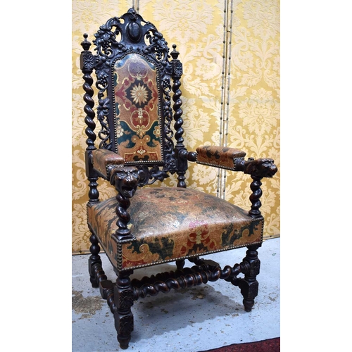 550 - A 19th century throne chair, the oak frame with pierced and carved back panel, lion head arms and ba... 