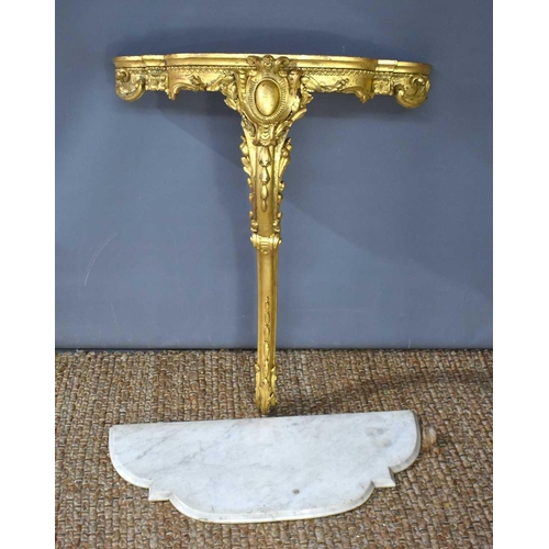 551 - A 19th century giltwood console table, with white marble top, the carved and gilded base having one ... 