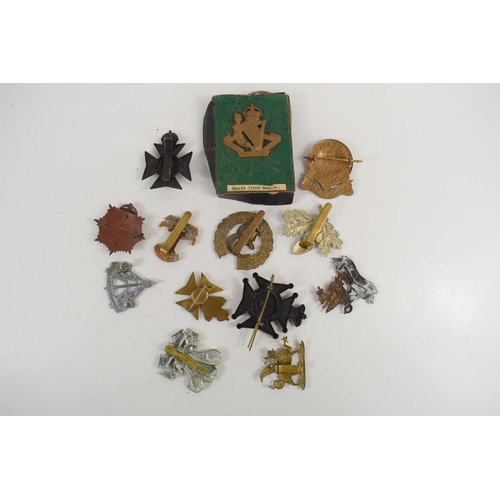 57 - A group of military cap badges to include Leicestershire Yeomanry South Africa 1900-02, North Irish ... 