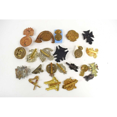 59 - A group of military cap badges to include Kings Royal Rifle Corps, Loyal Suffolk Hussars, 1st Battal... 