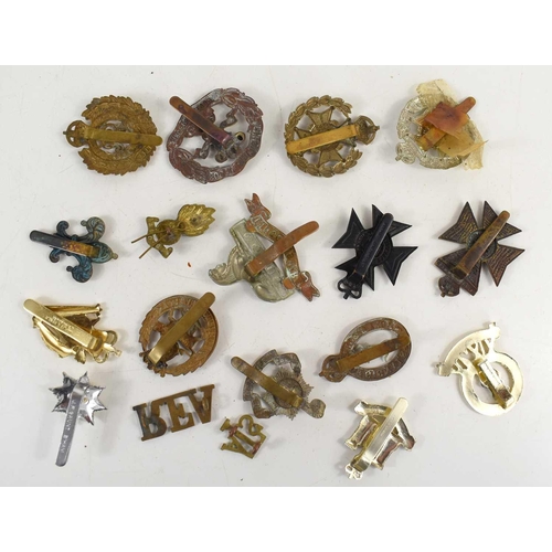 65 - A group of military cap badges to include Prince of Wales Volunteers, South Lancashire Regiment, She... 