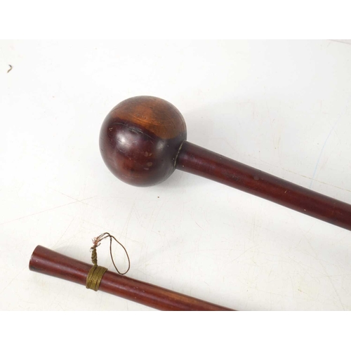 76 - Two similar Knobkerries, likely late 19th or early 20th century, each with carved wooden spherical h... 