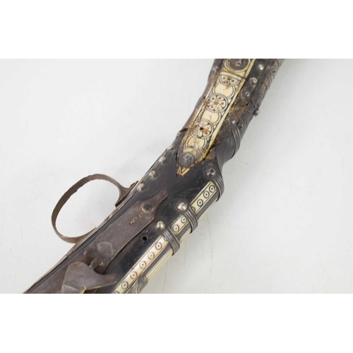 81 - A 19th century Ottoman flintlock long bore rifle, Black Bess rifle action, having bone inlaid decora... 