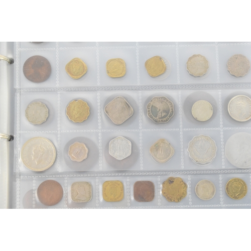 100a - Three coin albums containing GB and worldwide coins, some silver, to include a George III 1797 cartw... 