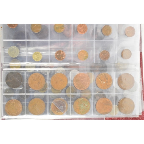 100a - Three coin albums containing GB and worldwide coins, some silver, to include a George III 1797 cartw... 