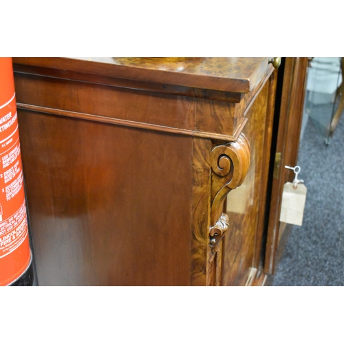 536 - A Victorian burr walnut chiffonier sideboard having two drawers above two cupboard doors, 93cms tall... 