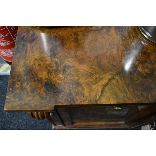 536 - A Victorian burr walnut chiffonier sideboard having two drawers above two cupboard doors, 93cms tall... 