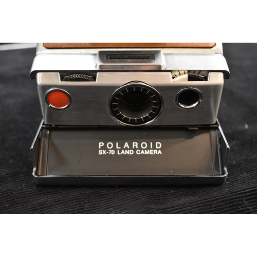 380 - A vintage Polaroid SX-70 land camera.