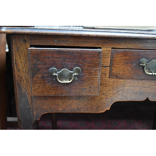 534 - A 17th century oak lowboy, with three short drawers to the front, raised on tapered legs with pad fe... 