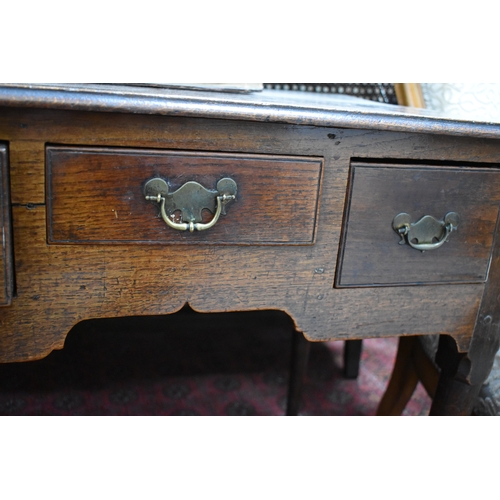 534 - A 17th century oak lowboy, with three short drawers to the front, raised on tapered legs with pad fe... 