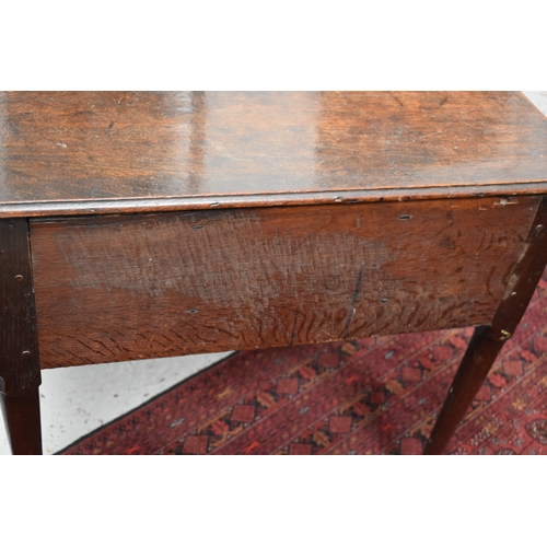 534 - A 17th century oak lowboy, with three short drawers to the front, raised on tapered legs with pad fe... 