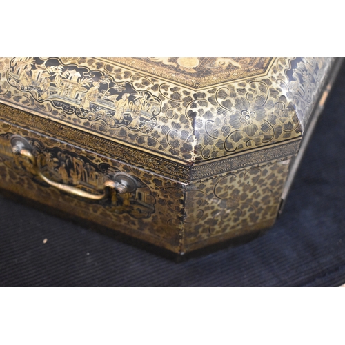 331 - A 19th century Chinese lacquer workbox, of rectangular form with canted corners, the black ground wi... 