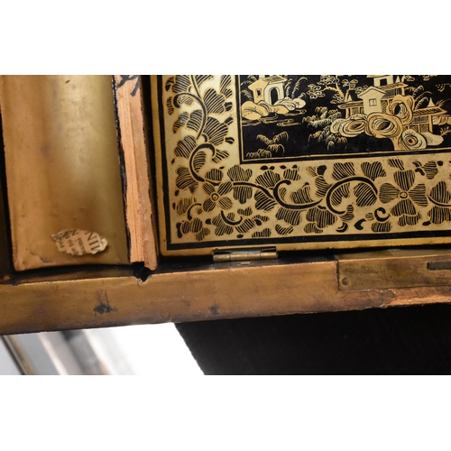 331 - A 19th century Chinese lacquer workbox, of rectangular form with canted corners, the black ground wi... 