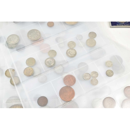 64 - A large collection of GB and worldwide coinage, to include commemorative crowns, some silver coins, ... 