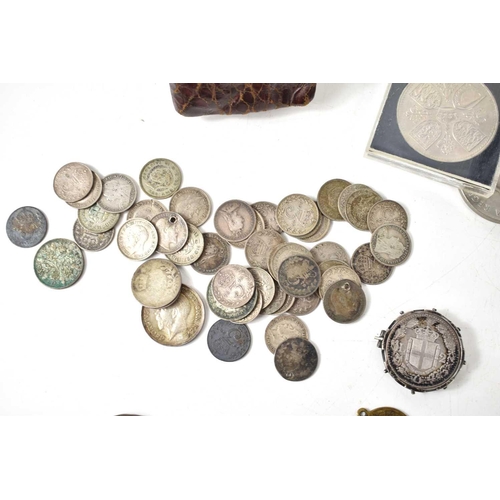 69 - A group of coins to include copper pennies, silver threepences, Italian silver coins, worldwide coin... 