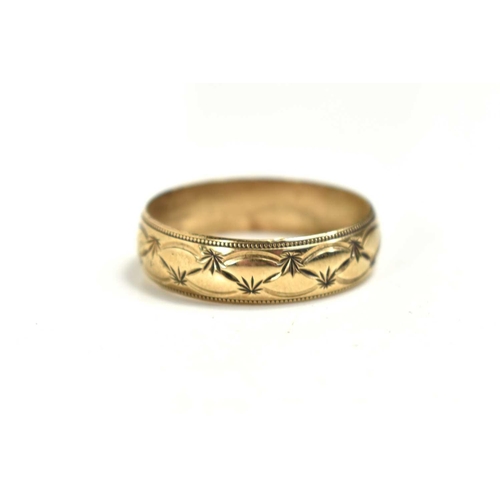 73 - A 9ct gold ring decorated with foliage, 5.1g.