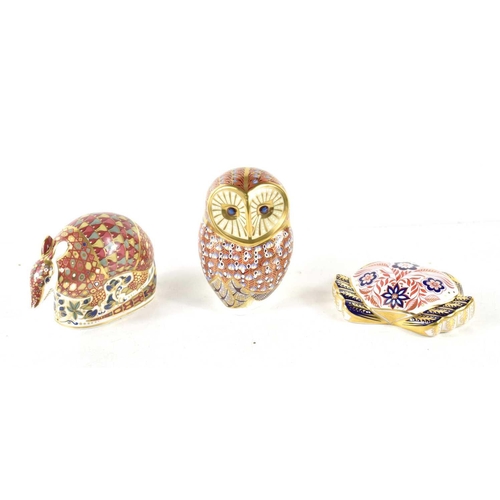 106 - A group of three Royal Crown Derby paperweights comprising of an Armadillo dated 1996, an Owl and a ... 