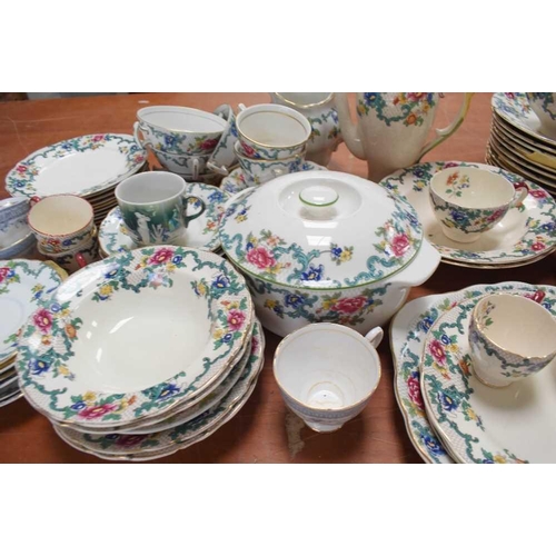 132 - A Royal Doulton part dinner service in the Floradora pattern, including cups, saucers, tureens and p... 