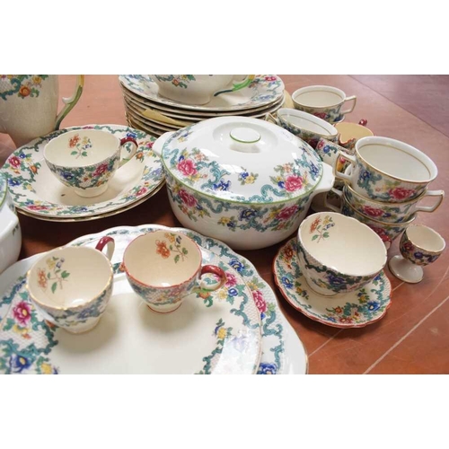 132 - A Royal Doulton part dinner service in the Floradora pattern, including cups, saucers, tureens and p... 