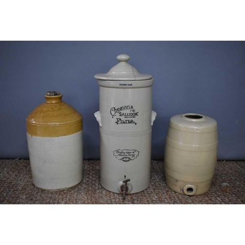 175 - A vintage stoneware Cheavin's Saludor save water filter, 62cm high, with lid and tap, and two furthe... 