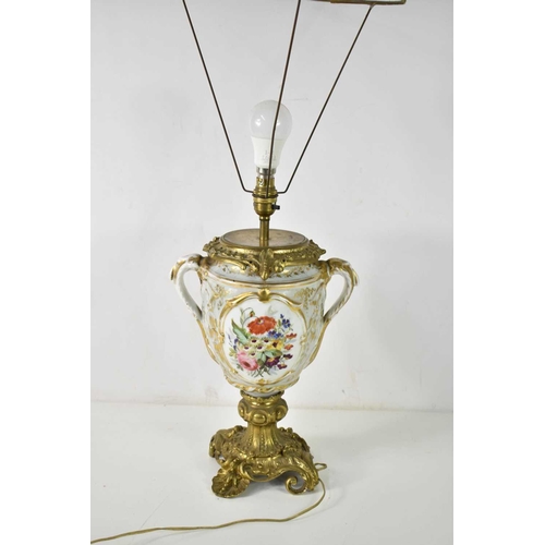 199 - A 19th century French Sevres style porcelain and gilt metal table lamp, the body having twin handles... 