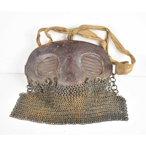 235 - A rare WWI tank crew splatter mask, steel base with leather padding, chain mail skirt and cloth stra... 