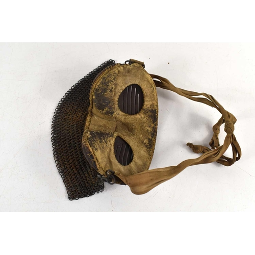 235 - A rare WWI tank crew splatter mask, steel base with leather padding, chain mail skirt and cloth stra... 