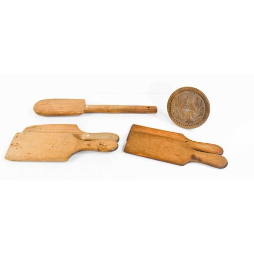 293 - A group of Victorian pine butter hand, two pairs of butter pats and a shortbread press.