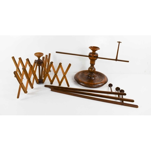 296 - Two 19th century treen wool winders / swifts, one with four scissor action retractable arms, the oth... 