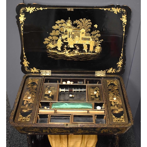 312 - A 19th century Chinoiserie black lacquered sewing table, decorated all over with figural scenes, and... 