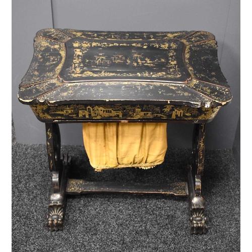 312 - A 19th century Chinoiserie black lacquered sewing table, decorated all over with figural scenes, and... 