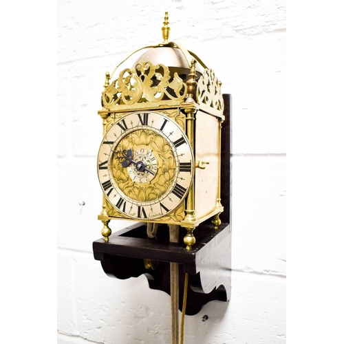 320 - A 19th century Scott of London brass lantern clock, the Roman numeral chapter ring bordering a centr... 