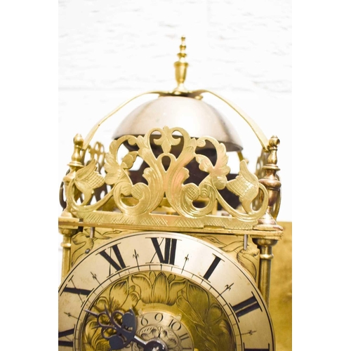 320 - A 19th century Scott of London brass lantern clock, the Roman numeral chapter ring bordering a centr... 