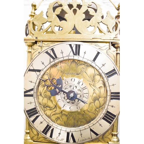 320 - A 19th century Scott of London brass lantern clock, the Roman numeral chapter ring bordering a centr... 